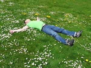 Under Cover - sleep positions - photo of man asleep on the grass