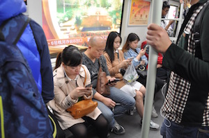 How to talk to strangers - photo of people focusing on their 'phones